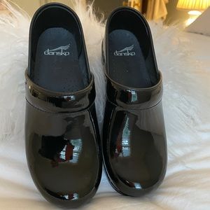 Dansko black patent leather clogs